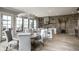 Well lit open concept kitchen and dining room featuring an island with chairs and stainless steel appliances at 12099 Sigillary Way, Carmel, IN 46032