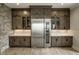 Kitchen with stainless steel refrigerator, wine cooler, and custom wood cabinetry at 12099 Sigillary Way, Carmel, IN 46032