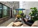 Cozy outdoor patio with modern furniture, elegant plantings, and string lights at 12099 Sigillary Way, Carmel, IN 46032
