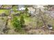 Aerial view of fenced backyard with lush lawn, mature trees and various landscape features at 12161 Pebblebrooke Ct, Indianapolis, IN 46236