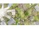Aerial view showcases backyard with mature trees and landscape features at 12161 Pebblebrooke Ct, Indianapolis, IN 46236