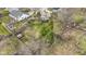 Aerial view of a backyard with a shed, wooden fence, and mature trees at 12161 Pebblebrooke Ct, Indianapolis, IN 46236