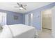 Bright bedroom with a ceiling fan and an ensuite closet for clothing storage at 12161 Pebblebrooke Ct, Indianapolis, IN 46236