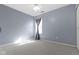Bedroom featuring a ceiling fan, a window, neutral carpet, and natural light at 12161 Pebblebrooke Ct, Indianapolis, IN 46236