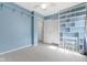 Bedroom featuring a built-in bookshelf, closet, and light-toned carpet at 12161 Pebblebrooke Ct, Indianapolis, IN 46236