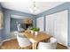 Dining room with natural wood floors, chandelier and view to living room at 12161 Pebblebrooke Ct, Indianapolis, IN 46236