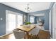 Dining room with natural wood floors, French doors, and a chandelier at 12161 Pebblebrooke Ct, Indianapolis, IN 46236
