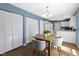 Dining room with natural wood floors, closet and view to kitchen at 12161 Pebblebrooke Ct, Indianapolis, IN 46236
