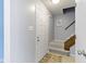 Bright entryway featuring carpeted stairs, closet, and a neutral color scheme for a welcoming entrance at 12161 Pebblebrooke Ct, Indianapolis, IN 46236