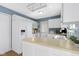 Clean white kitchen featuring ample cabinet space and a functional layout for cooking and entertaining at 12161 Pebblebrooke Ct, Indianapolis, IN 46236
