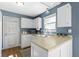 Functional kitchen showcasing white cabinets, a bright window, and a practical design for easy meal prep at 12161 Pebblebrooke Ct, Indianapolis, IN 46236