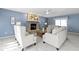Living room with stone fireplace, neutral furniture, and a ceiling fan at 12161 Pebblebrooke Ct, Indianapolis, IN 46236