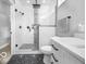 Bathroom features a modern shower with black fixtures and unique geometric patterned flooring at 1444 English Ave, Indianapolis, IN 46201