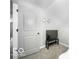 Cozy room with carpet, arched door, and a TV on a stand at 1444 English Ave, Indianapolis, IN 46201