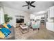Open-concept living area with modern furnishings, hardwood floors, and a stylish ceiling fan at 1444 English Ave, Indianapolis, IN 46201