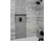 Shower stall with gray and white marbled tile and dark shower head and fixtures at 1444 English Ave, Indianapolis, IN 46201