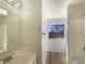 Bathroom features bright vanity, window, and enclosed shower at 14466 Chapelwood Ln, Fishers, IN 46037