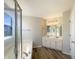 Bright bathroom featuring a double vanity, walk-in shower, soaking tub, and neutral color palette at 14466 Chapelwood Ln, Fishers, IN 46037
