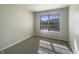 Light-filled bedroom with plush carpet and bright window at 14466 Chapelwood Ln, Fishers, IN 46037