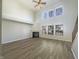 Bright living room featuring a fireplace, soaring ceilings, multiple windows and light, modern flooring at 14466 Chapelwood Ln, Fishers, IN 46037