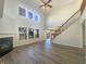 Spacious living room with high ceilings, fireplace, and lots of natural light at 14466 Chapelwood Ln, Fishers, IN 46037