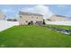 Large backyard features green grass, a white fence, and a patio with grill, chairs, and table at 1464 Hession Dr, Brownsburg, IN 46112