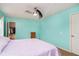 Cozy bedroom with a closet, ceiling fan, and a comfortable bed for relaxation at 1464 Hession Dr, Brownsburg, IN 46112