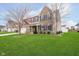 Charming two-story home with brick and siding exterior, well-manicured lawn and attached two-car garage at 1464 Hession Dr, Brownsburg, IN 46112