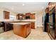 Well-equipped kitchen with granite countertops, an island, stainless steel appliances, and custom cabinetry at 1464 Hession Dr, Brownsburg, IN 46112
