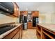 Modern kitchen with granite countertops, stainless steel appliances, an island, and ample cabinetry at 1464 Hession Dr, Brownsburg, IN 46112