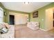 Inviting living room featuring carpet, neutral walls, bright windows, and comfortable seating at 1464 Hession Dr, Brownsburg, IN 46112