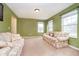 Bright living room featuring carpet, neutral walls, bright windows, and comfortable seating at 1464 Hession Dr, Brownsburg, IN 46112