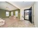 Cozy living room featuring carpet, neutral walls, bright windows, and an open entryway at 1464 Hession Dr, Brownsburg, IN 46112