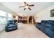 Bright, open-concept living room with seamless transition into the kitchen and stairs to the upper floor at 1464 Hession Dr, Brownsburg, IN 46112