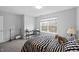 Bright bedroom features a work space and a large window at 14974 Dry Creek Rd, Noblesville, IN 46060