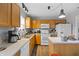 Bright kitchen featuring ample counter space, light wood cabinets, and modern appliances for a delightful cooking experience at 14974 Dry Creek Rd, Noblesville, IN 46060