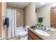 Cozy bathroom with granite countertop, tiled walls, a shower and tub, perfect for relaxing at 1529 Alabama N St # H, Indianapolis, IN 46202