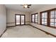 Cozy bedroom featuring carpet flooring, neutral walls, and natural light at 1529 Alabama N St # H, Indianapolis, IN 46202