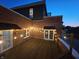 View of a stylishly decorated deck at night, featuring charming string lights and a cozy atmosphere for evening relaxation at 1529 Alabama N St # H, Indianapolis, IN 46202
