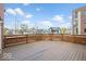 Expansive wooden deck providing views of the neighborhood, perfect for outdoor entertaining and enjoying the scenery at 1529 Alabama N St # H, Indianapolis, IN 46202