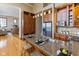 Gourmet kitchen with granite countertops, stainless steel appliances, custom cabinets, and breakfast bar at 1529 Alabama N St # H, Indianapolis, IN 46202