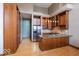 Spacious kitchen with wooden cabinets, stainless steel appliances, and granite countertop, perfect for entertaining at 1529 Alabama N St # H, Indianapolis, IN 46202