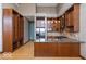 Modern kitchen with custom cabinetry, stainless steel appliances, granite counters, and hardwood floors at 1529 Alabama N St # H, Indianapolis, IN 46202