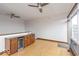 Bright living room with hardwood floors, built-in bar, and modern finishes, creating an inviting space for entertaining and relaxation at 1529 Alabama N St # H, Indianapolis, IN 46202