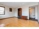 Comfortable living room featuring hardwood floors and a decorative fireplace at 1529 Alabama N St # H, Indianapolis, IN 46202