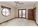 Bright bedroom featuring carpet flooring, modern fixtures, and doors to balcony at 1529 Alabama N St # H, Indianapolis, IN 46202