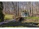 Backyard bridge leading to a wooden gazebo at 1591 Preston Trl, Carmel, IN 46032