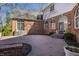 Brick patio and backyard of home with brick exterior and arched windows at 1591 Preston Trl, Carmel, IN 46032