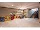 Expansive basement space, perfect for recreation, with a neutral color palette and plush carpeting at 1591 Preston Trl, Carmel, IN 46032