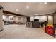 Spacious basement area providing ample room for play, relaxation, and entertainment with comfortable seating at 1591 Preston Trl, Carmel, IN 46032